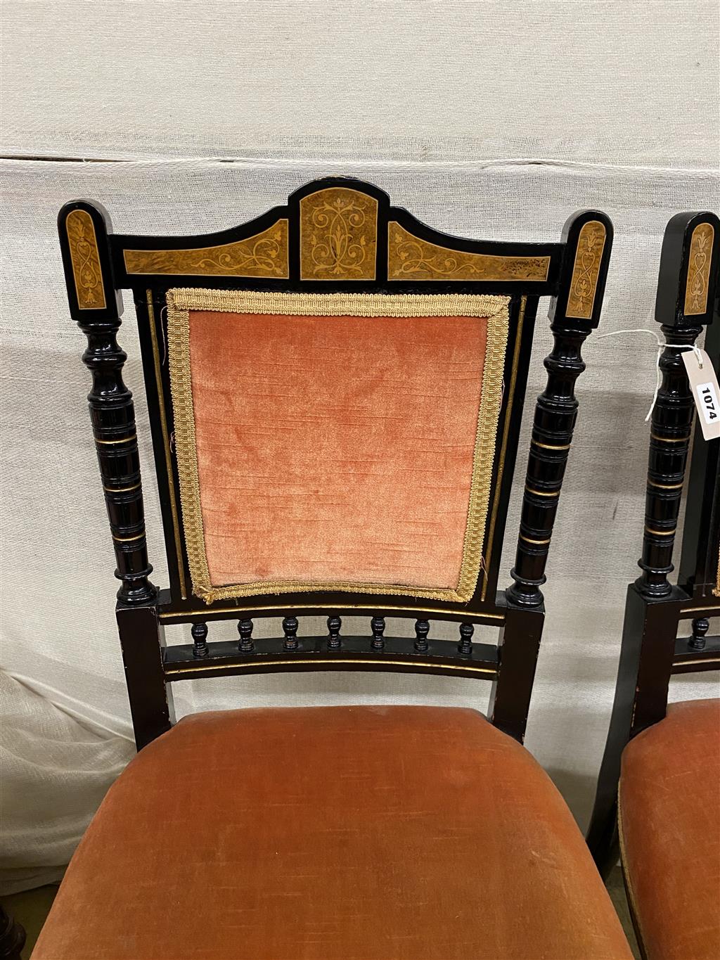 A pair of late Victorian marquetry inlaid ebonised side chairs